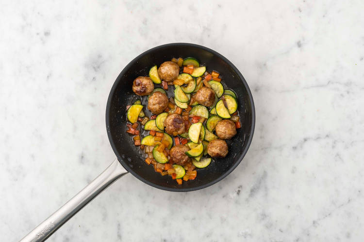 Mix veggies and meatballs with sauce