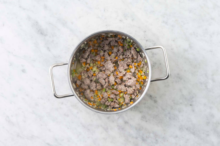 Cook sausage and mirepoix