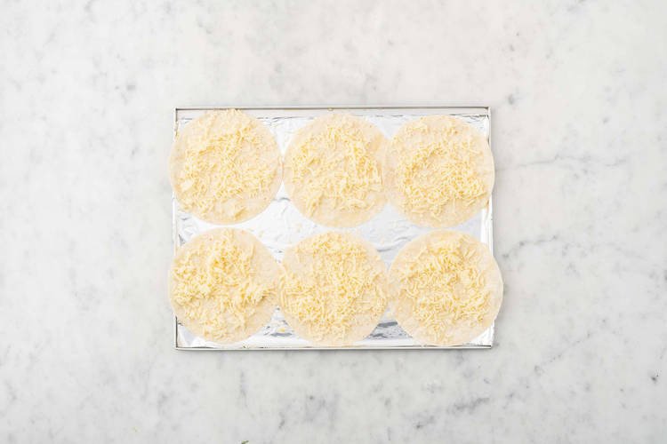 Melt cheese on tortillas