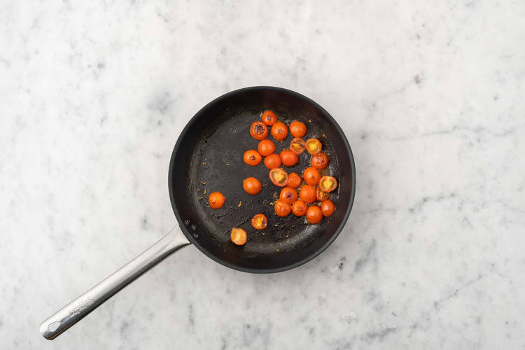 Cook tomatoes and make pizzas