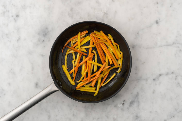 Toast sesame seeds and cook veggies