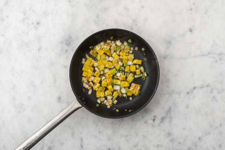 Cook pepper and onions