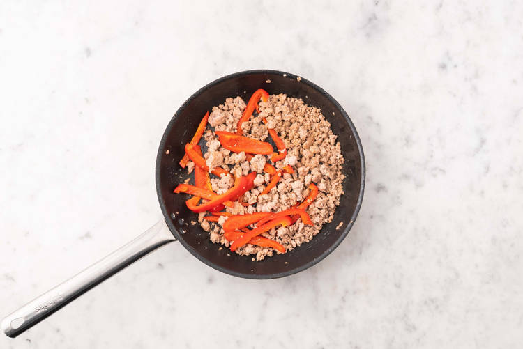 Cook sausage and peppers