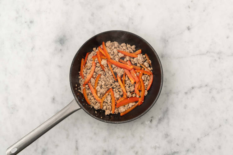 Cook sausage, bacon and peppers