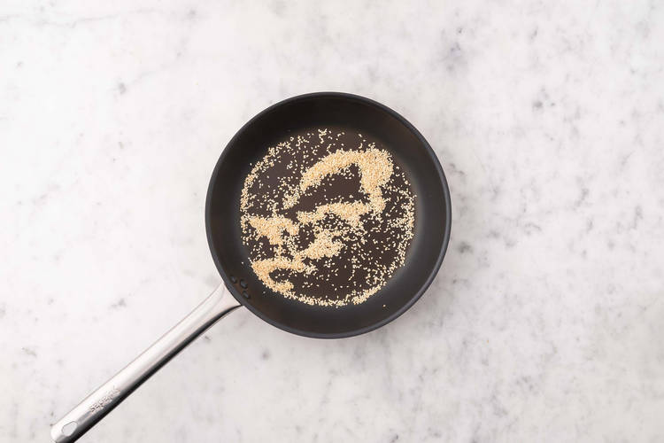 Toast sesame seeds and prep tomatoes