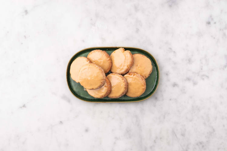 Glaze cookies and serve