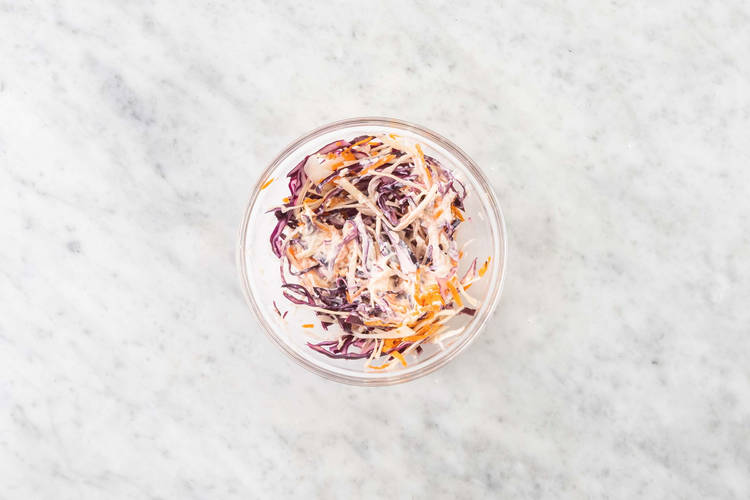 Pickle onions and mix slaw