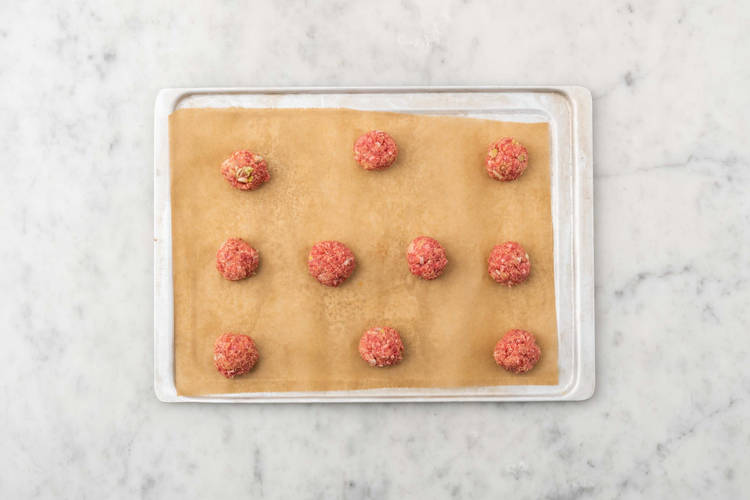 Bake meatballs and asparagus