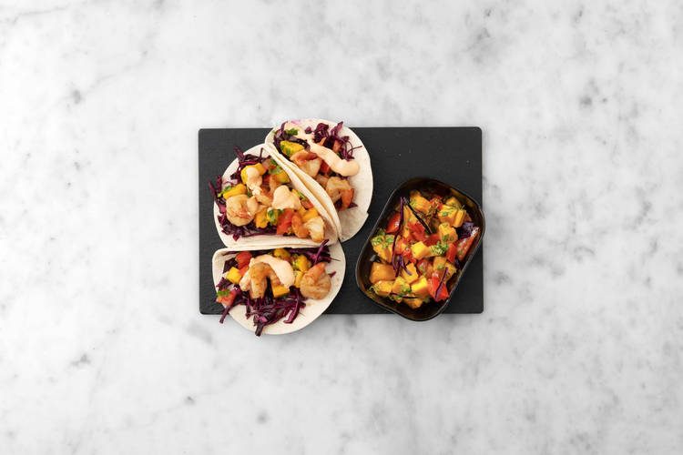 Warm tortillas and serve