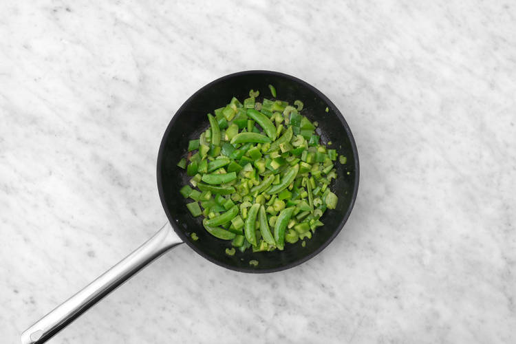 Toast peanuts and stir-fry veggies