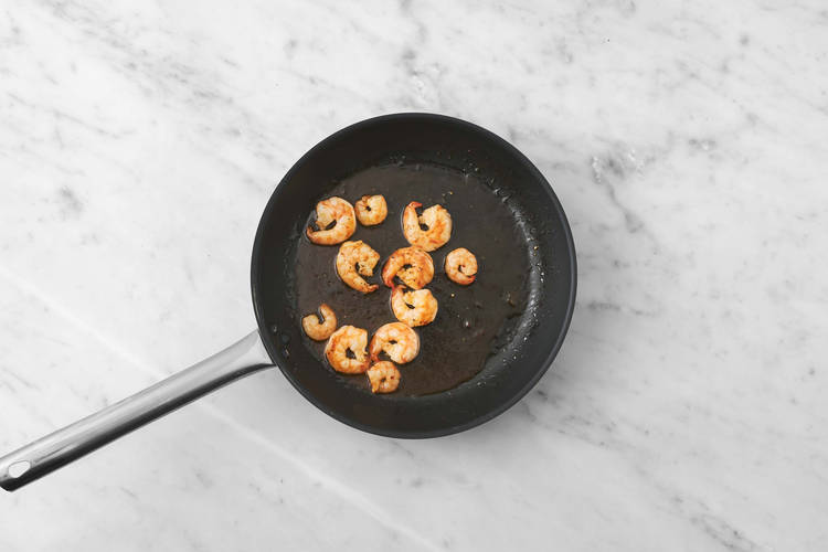 Cook peppers and shrimp