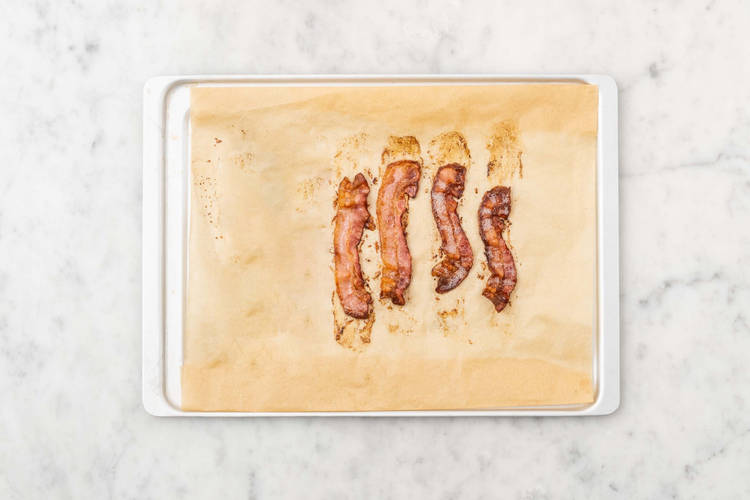 Boil water and cook bacon