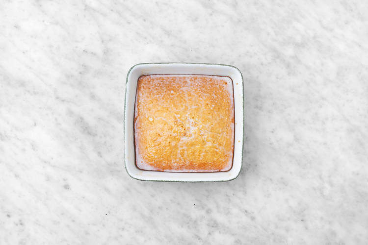 Make coconut milk mixture and prep cake