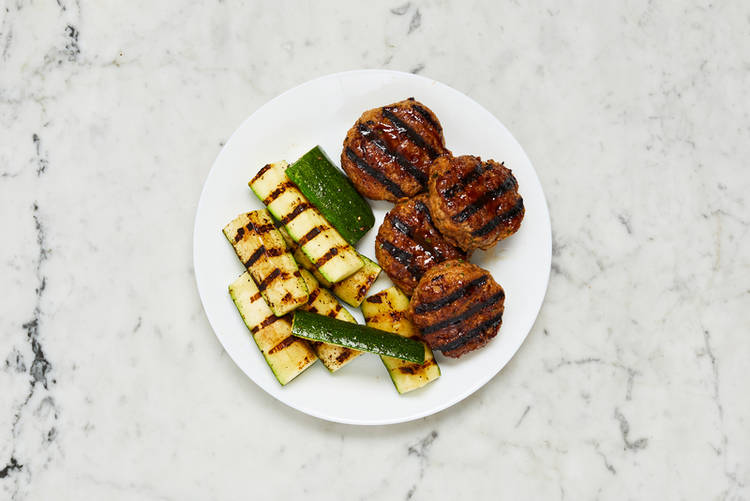 Grill patties and zucchini