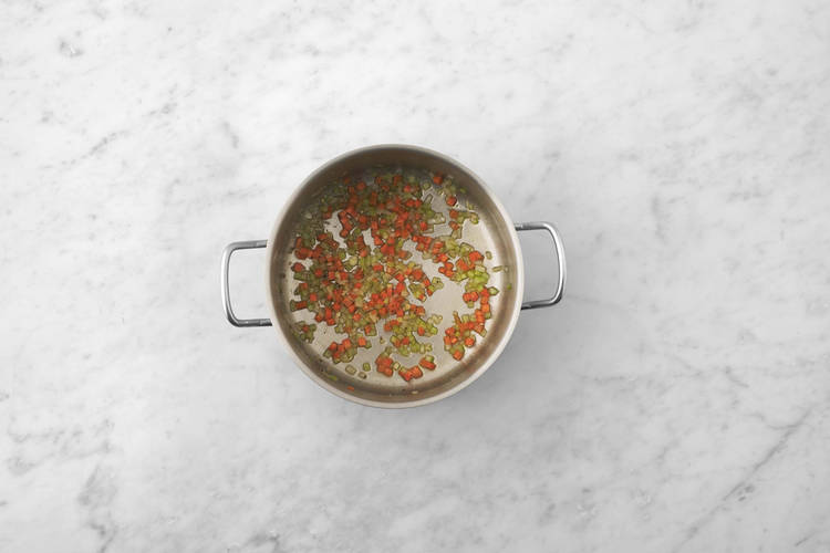 Cook mirepoix and chicken
