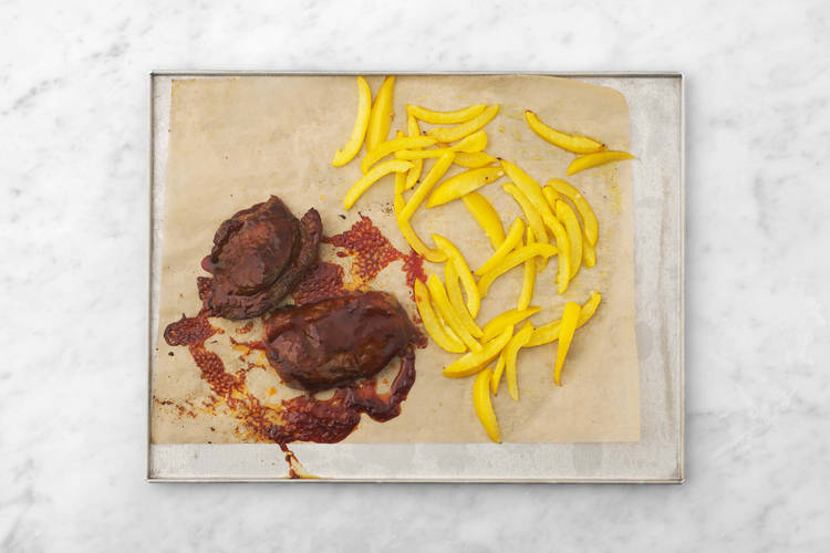 Cook steaks and peppers