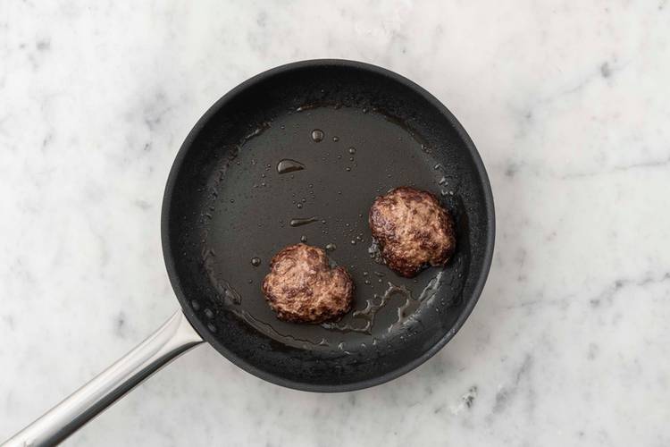 Cook patties and toast buns