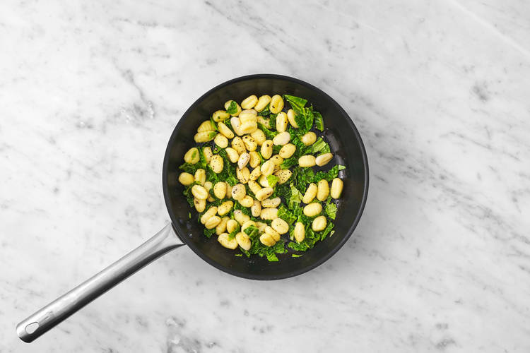 Cook gnocchi and kale
