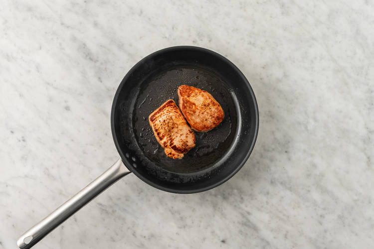 Season and sear pork