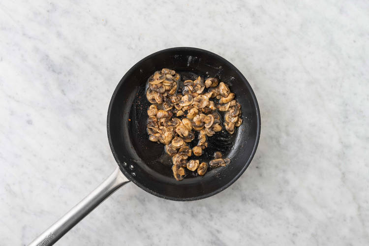 Cook sausage and mushrooms