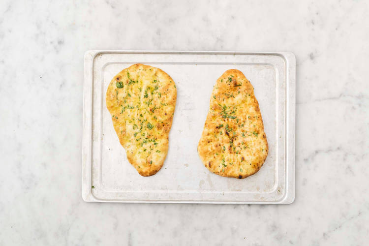 Warm flatbreads and tikka sauce