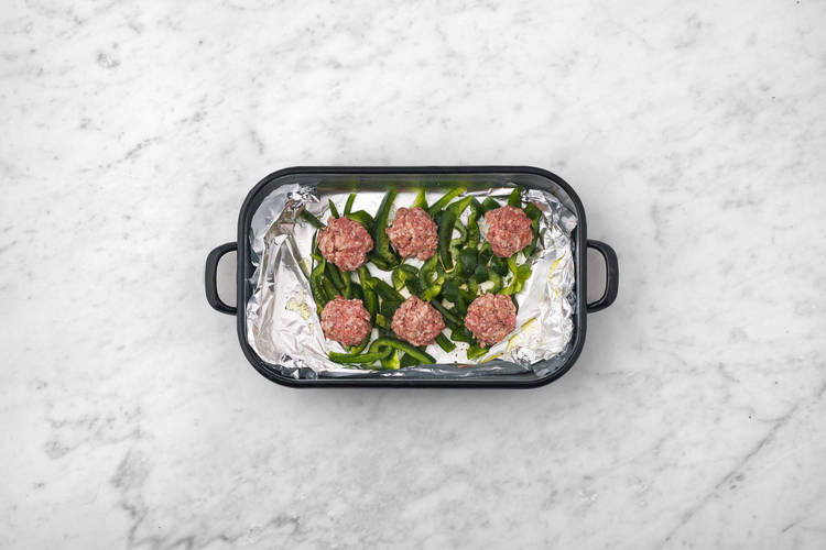 Broil sausage and pepeprs