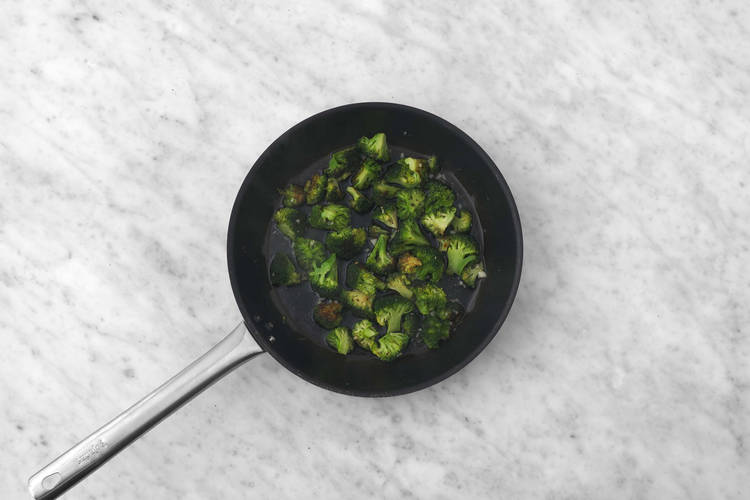 Cook salmon and cook veggies