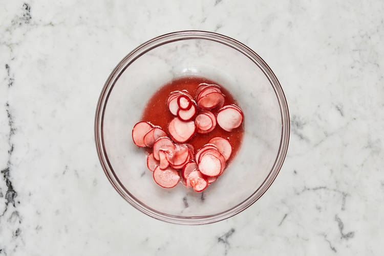 Cook couscous and marinate radishes