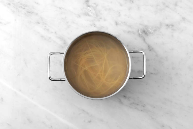 Cook spaghetti and corn