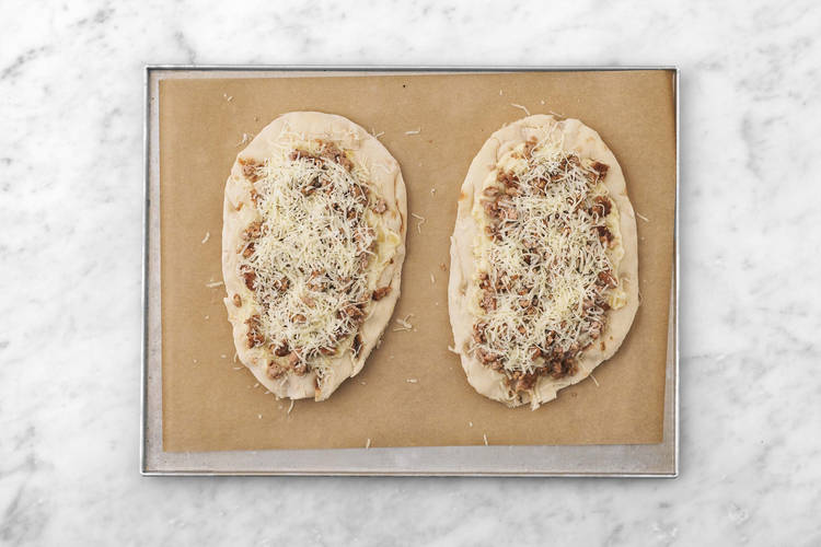 Assemble pizzas