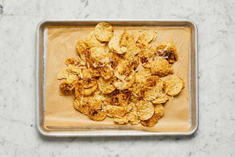 Bake tortilla chips and make pico de gallo