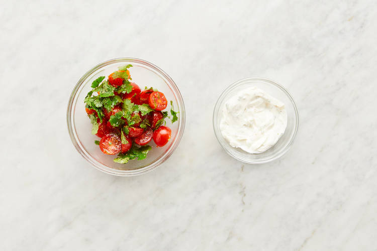 Marinate tomatoes and make crema