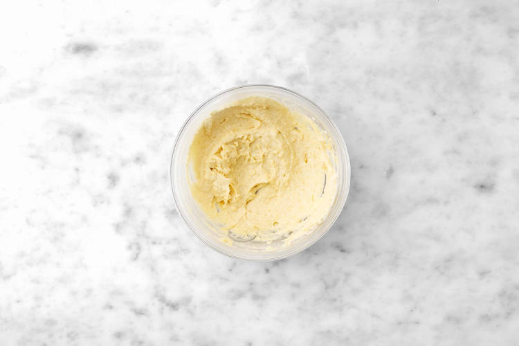 Cool cake and make frosting