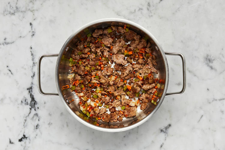 Cook sausage and veggies