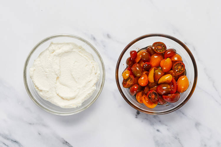 Season ricotta and tomatoes