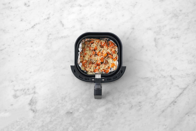 Bake the cheesy sweet potato chunks