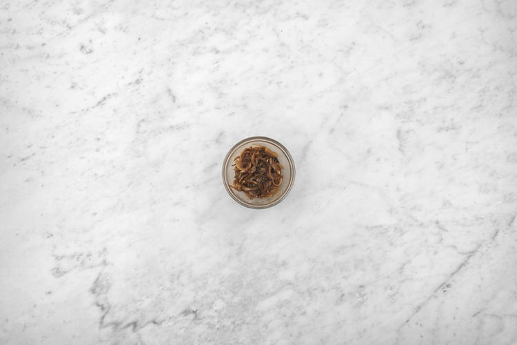 Make the caramelised onion & olive sauce