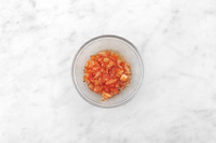 Season the tomato & heat the tortillas