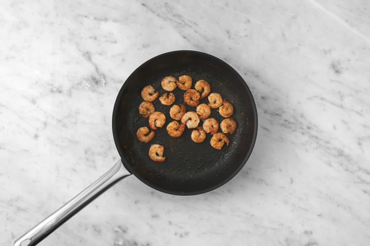 Cook the prawns and chorizo