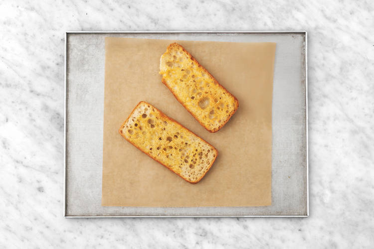 Make the garlic bread & radish salad