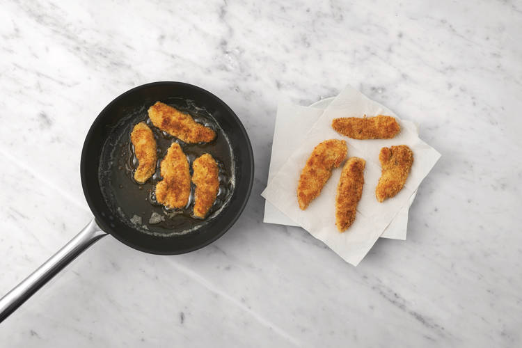 Cook the crumbed chicken