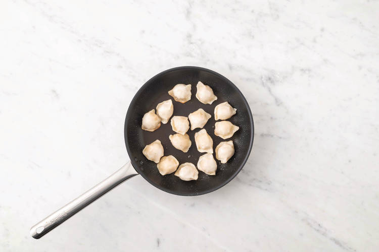 Cook the gyozas