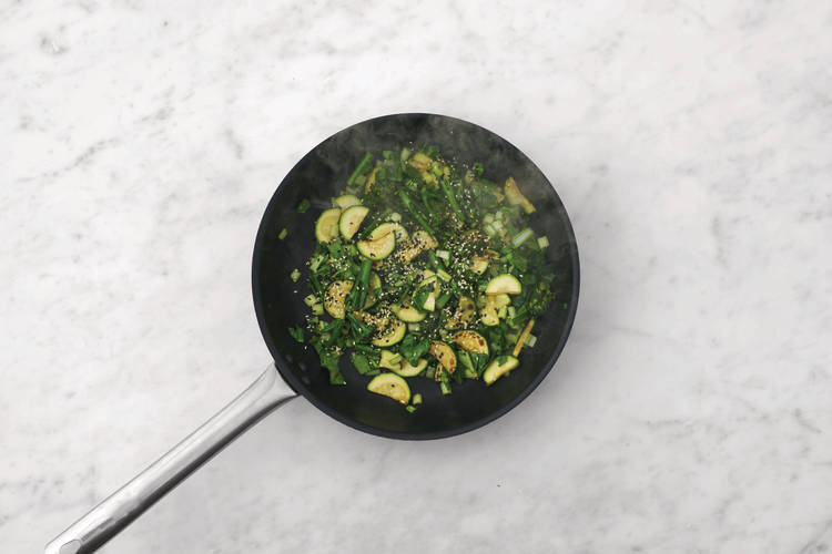 Stir-fry the greens