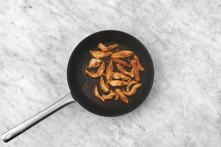 Cook the plant-based crumbed chicken