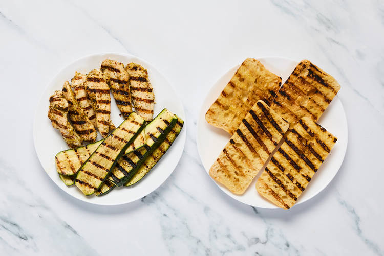 Grill chicken and zucchini and toast buns