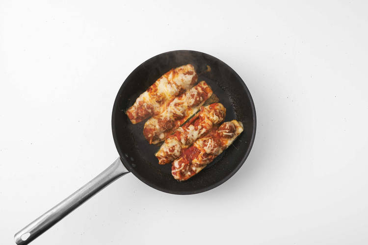 Fill the courgette boats