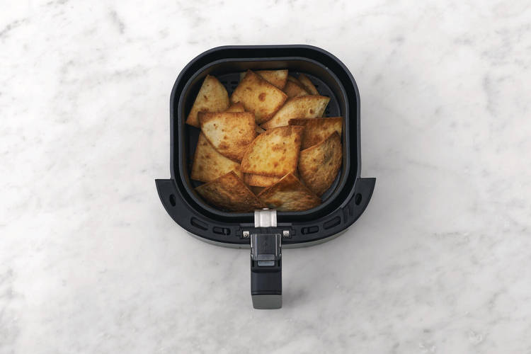 Cook the nacho chips 