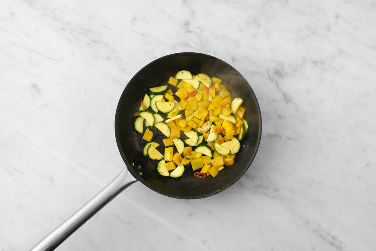 Cook veggies and shrimp