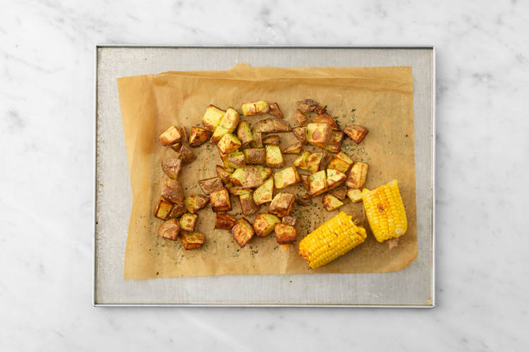 Roast the potatoes & corn