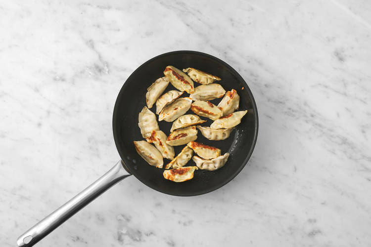 Cook the gyozas & chicken